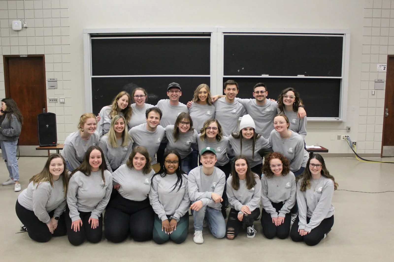 The Spartan Speech club posing together in matching shirts